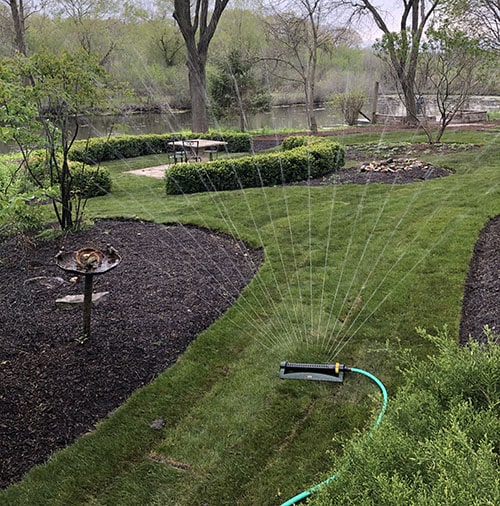 Fresh sod installation in a residential backyard by Plant Garden Landscaping in Harvard IL